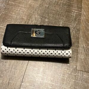 GUESS Black & White Wallet..7”x4” w/Silver Guess Emblem on front. Preowned